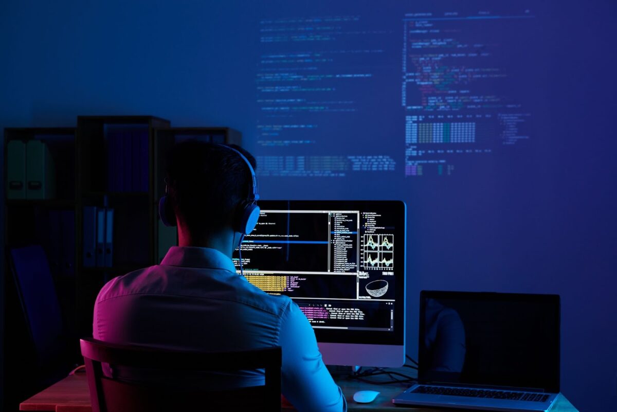 Programmer working with code all night long